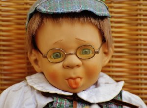 doll wearing eyeglasses
